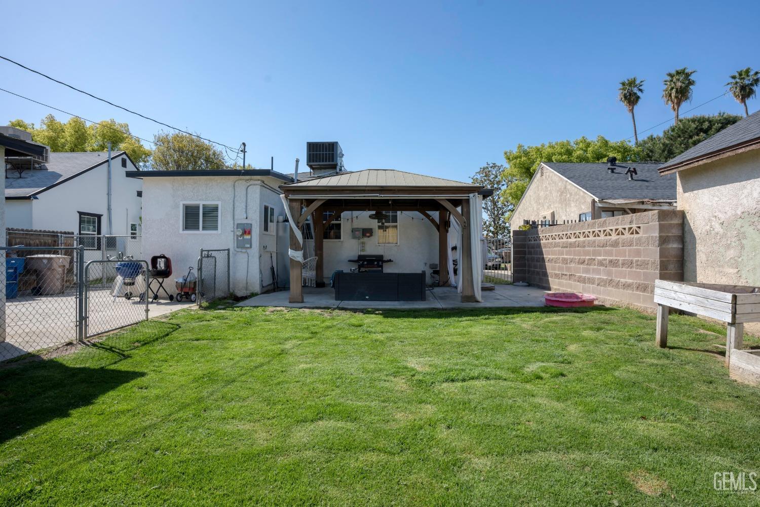 Undisclosed Address Bakersfield, CA 93304 - Photo 26 of 31 a front view of a house with garden