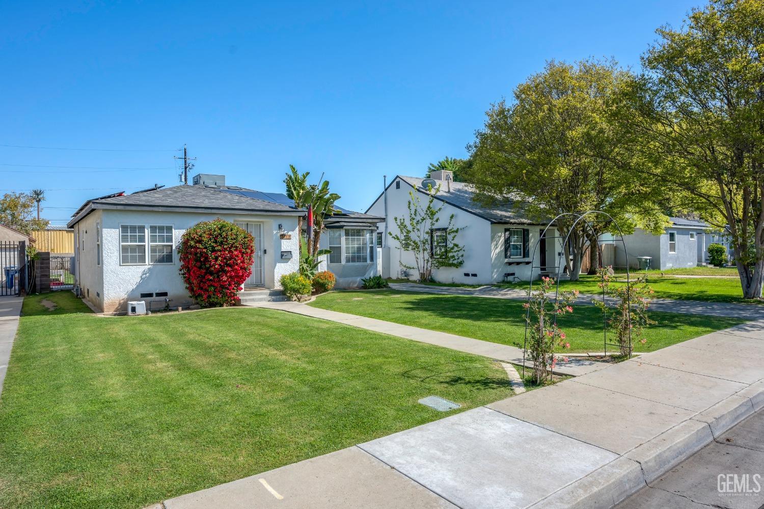 Undisclosed Address Bakersfield, CA 93304 - Photo 3 of 31 a front view of a house with garden