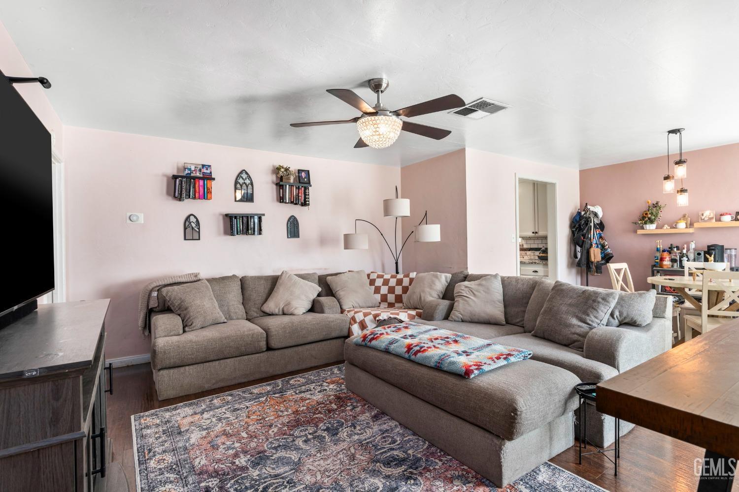 Undisclosed Address Bakersfield, CA 93304 - Photo 6 of 31 a living room with furniture and a flat screen tv