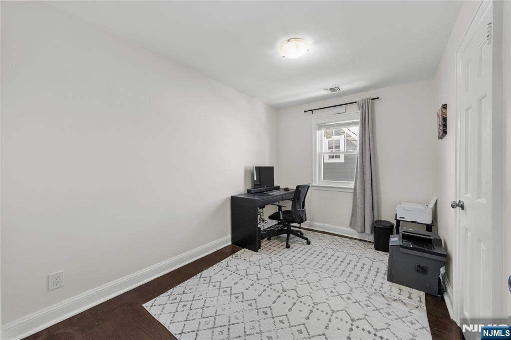 609 Wyndham Road Teaneck, NJ 07666 - Photo 15 of 26 a room that has a couch and a chair in it