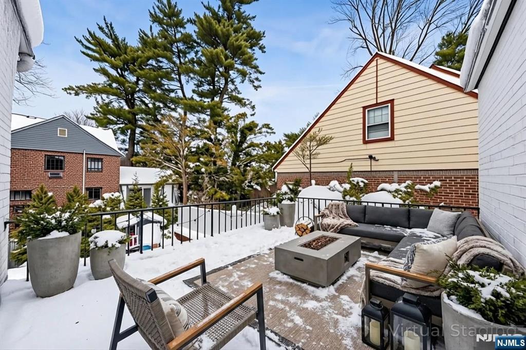 609 Wyndham Road Teaneck, NJ 07666 - Photo 16 of 26 a backyard of a house with fire pit and outdoor seating