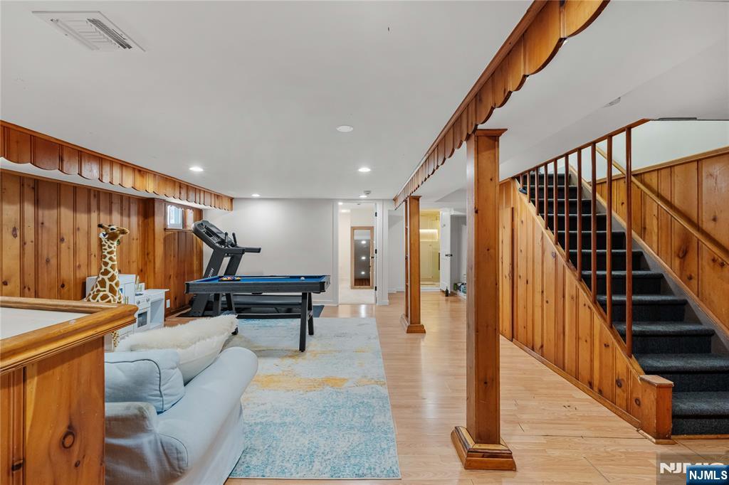 609 Wyndham Road Teaneck, NJ 07666 - Photo 17 of 26 a living room with furniture and wooden floor