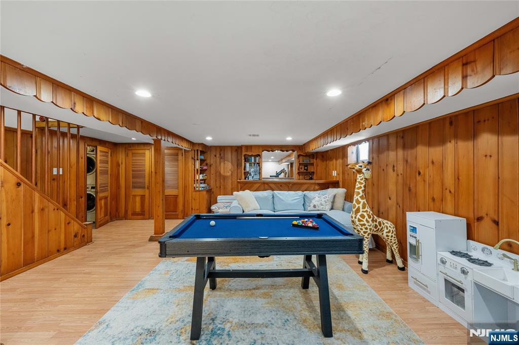 609 Wyndham Road Teaneck, NJ 07666 - Photo 18 of 26 a living room with furniture a rug and a wooden floor