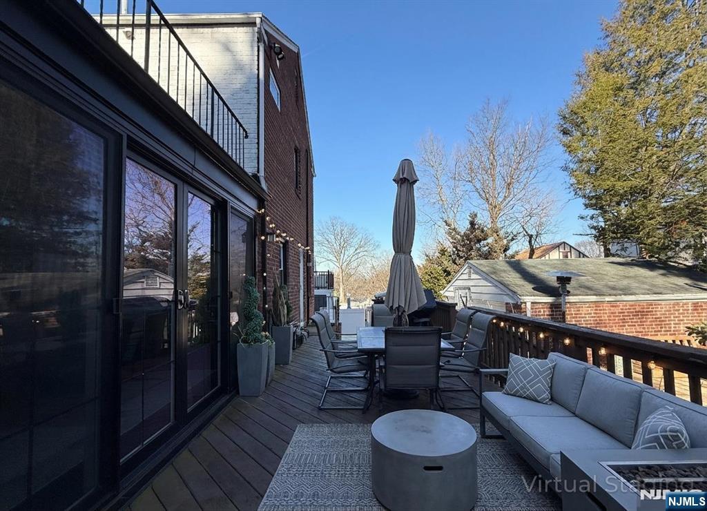 609 Wyndham Road Teaneck, NJ 07666 - Photo 24 of 26 a view of a balcony with chairs and a potted plant