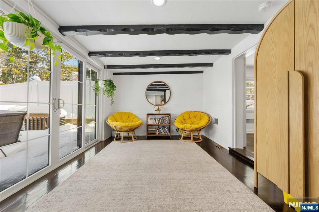 609 Wyndham Road Teaneck, NJ 07666 - Photo 3 of 26 a front view of a house with chairs