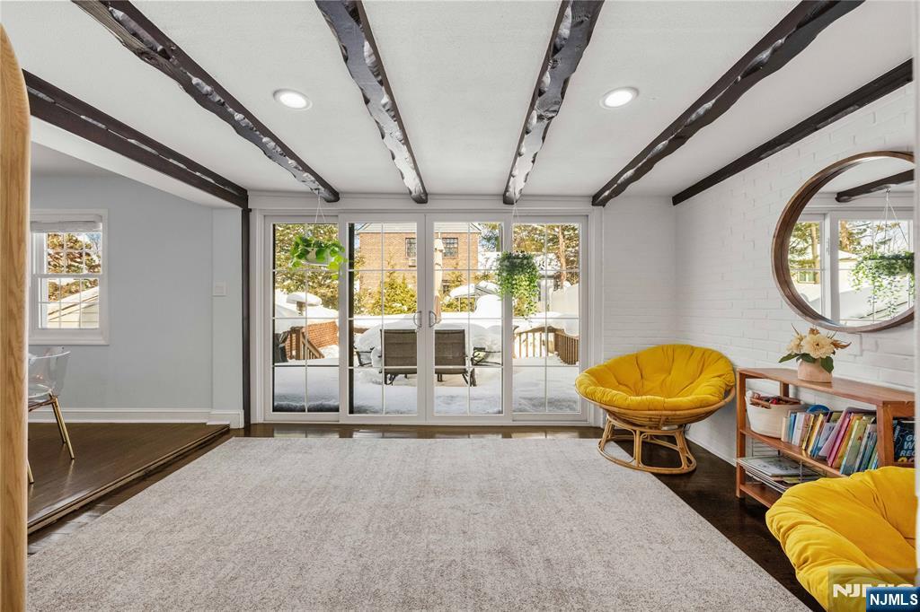 609 Wyndham Road Teaneck, NJ 07666 - Photo 4 of 26 a view of a livingroom with furniture and a swimming pool