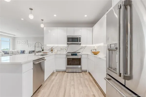 a kitchen with a sink stove and microwave