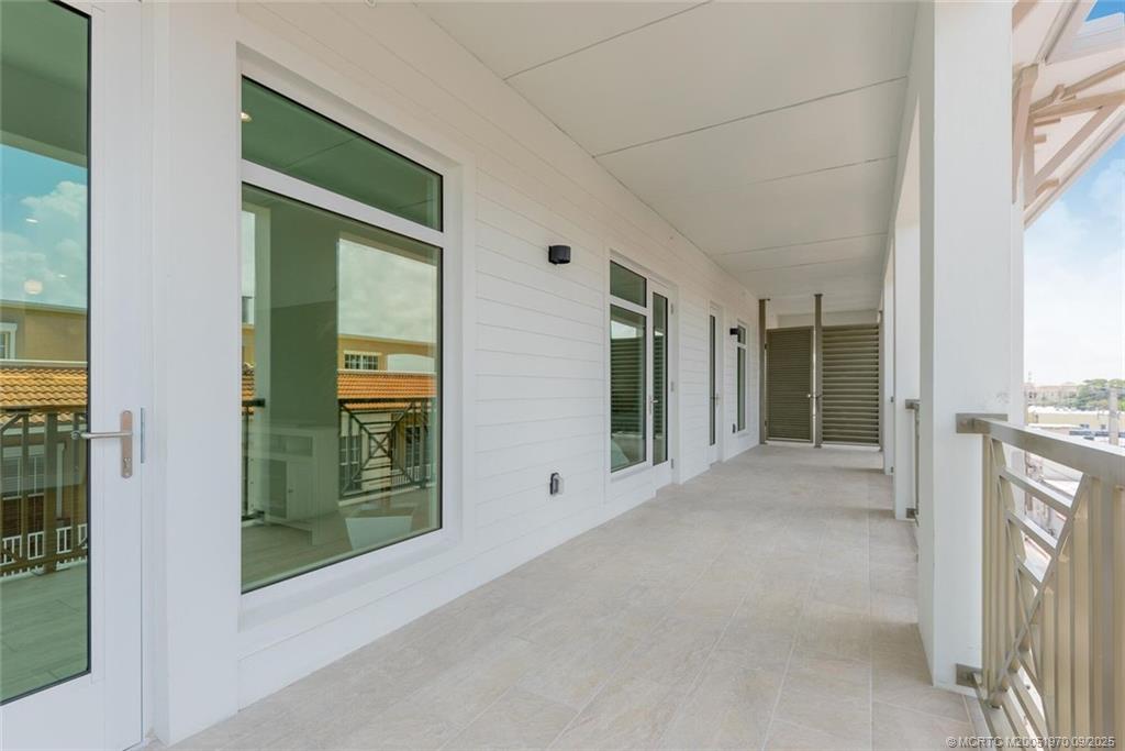 41 Southwest Seminole Street, Unit 410 Stuart, FL 34994 - Photo 13 of 54 a view of a house with a porch