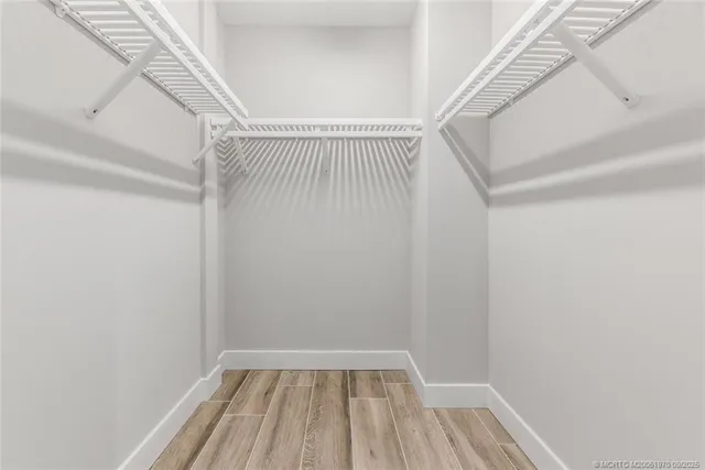 a bathroom with a shower sink and mirror