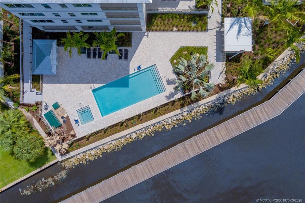 41 Southwest Seminole Street, Unit 410 Stuart, FL 34994 - Photo 44 of 54 an aerial view of a house with a garden