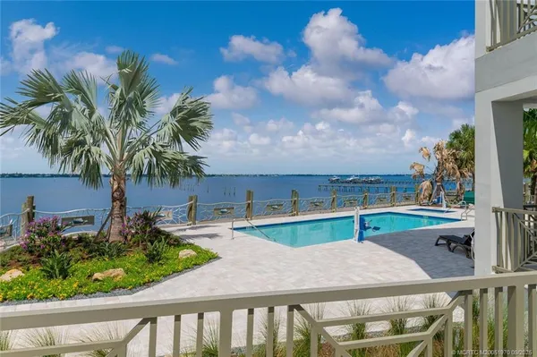 a view of swimming pool with lounge chair