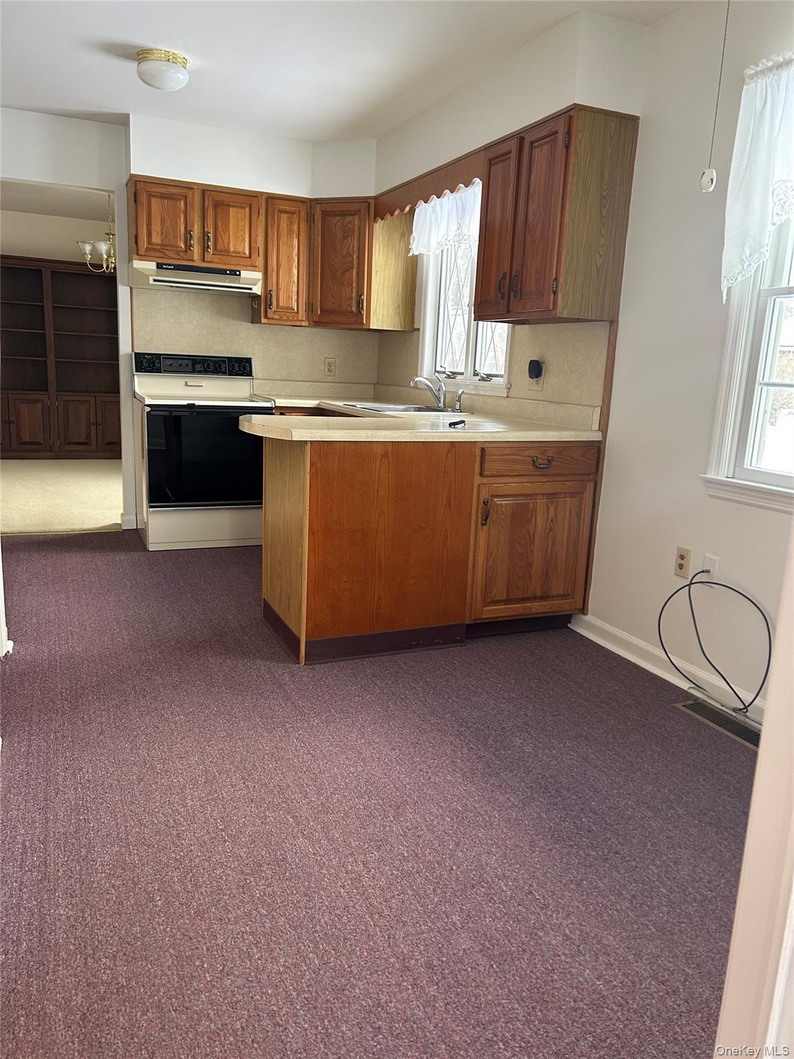2 Scism Circle Red Hook, NY 12571 - Photo 12 of 29 a kitchen with stainless steel appliances a sink a stove a microwave a sink a refrigerator and cabinets