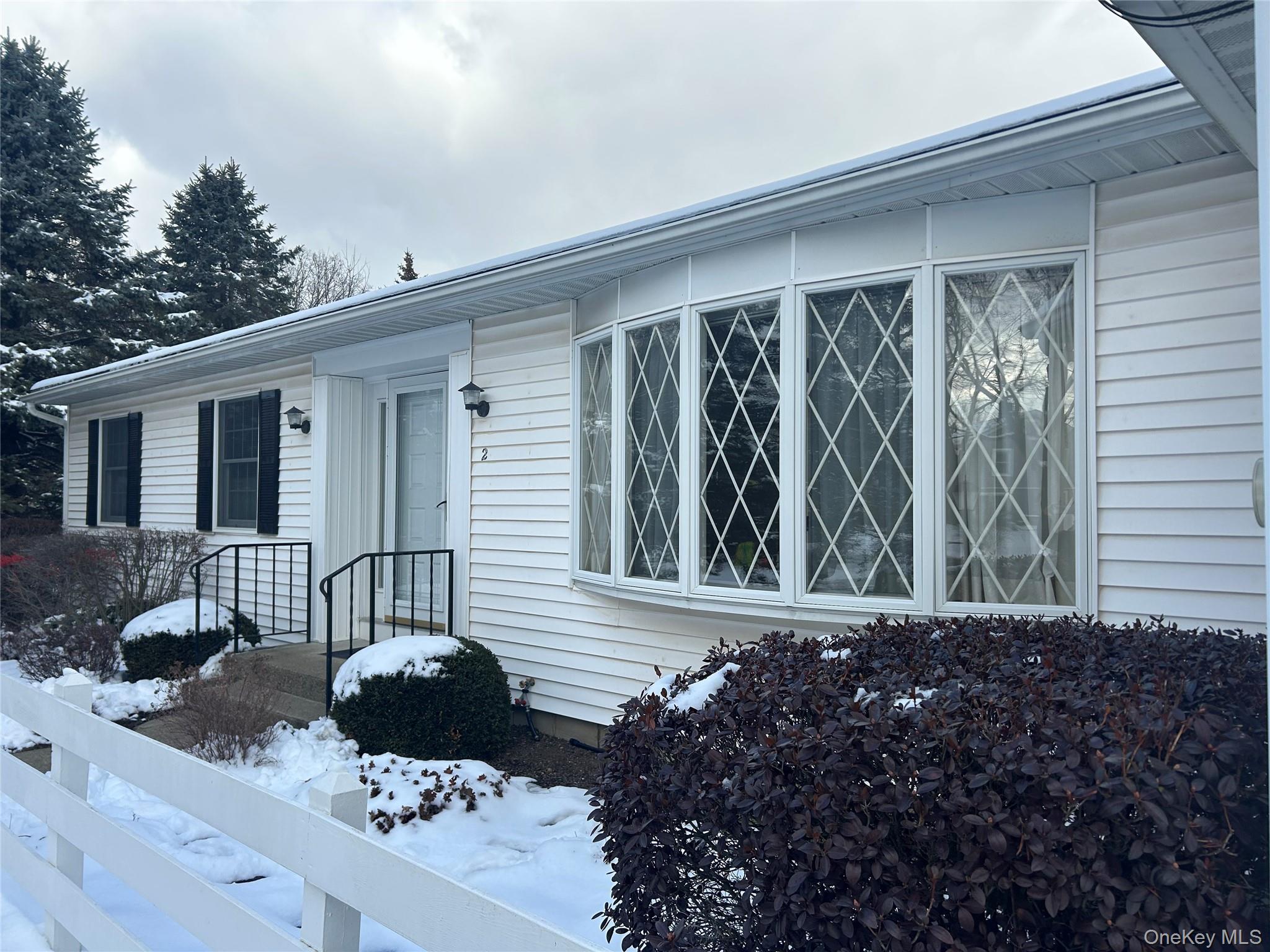 2 Scism Circle Red Hook, NY 12571 - Photo 2 of 29 a front view of a house with garden