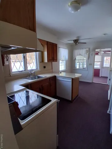a living room with furniture and windows