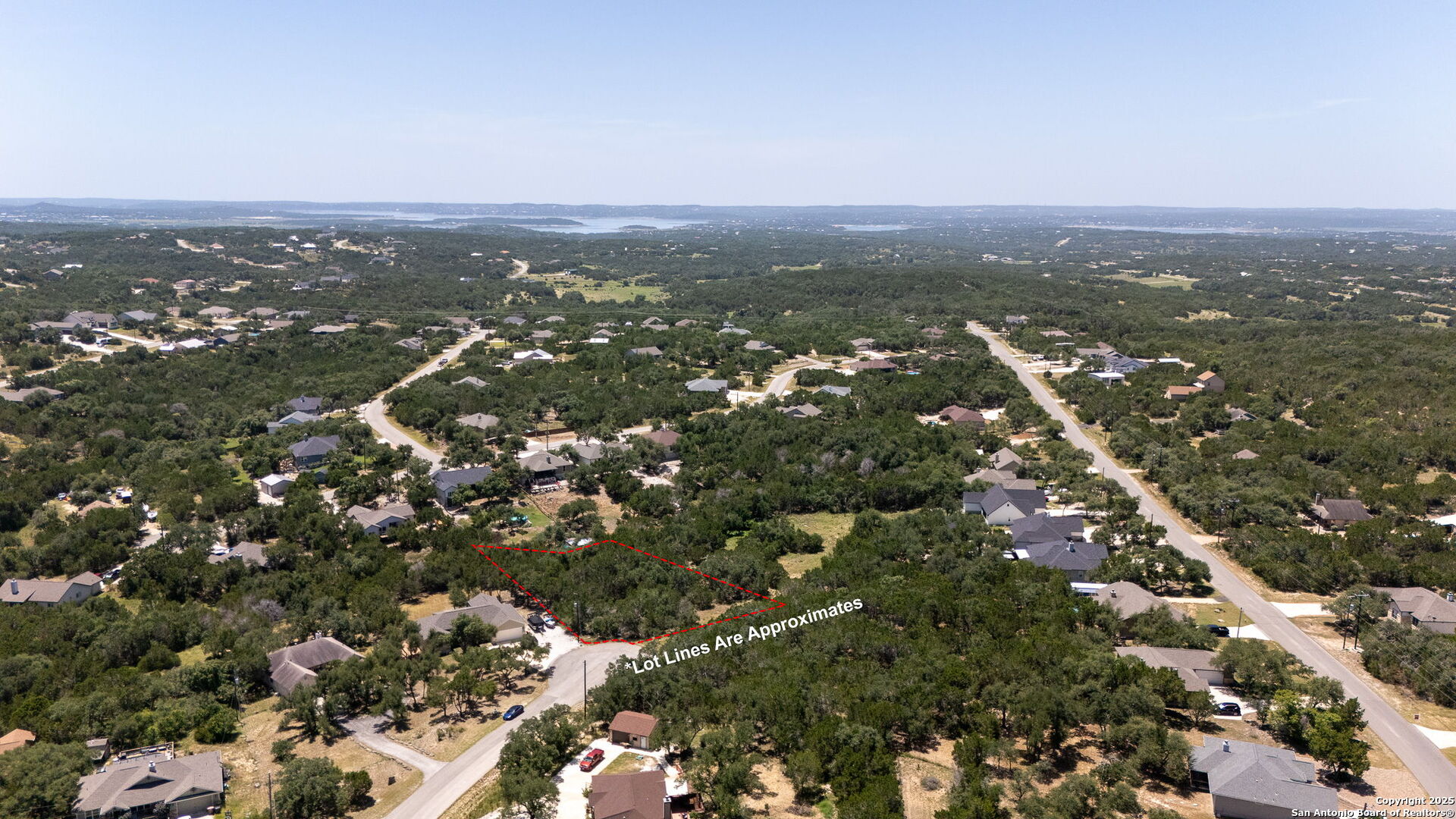 1465 Ironwood Road Fischer, TX 78623 - Photo 1 of 9 an aerial view of town with residential houses with city view