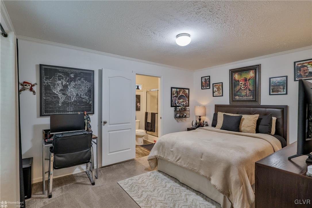 8711 Turkey Ridge Road Breinigsville, PA 18031 - Photo 24 of 40 a bedroom with a bed and a workspace
