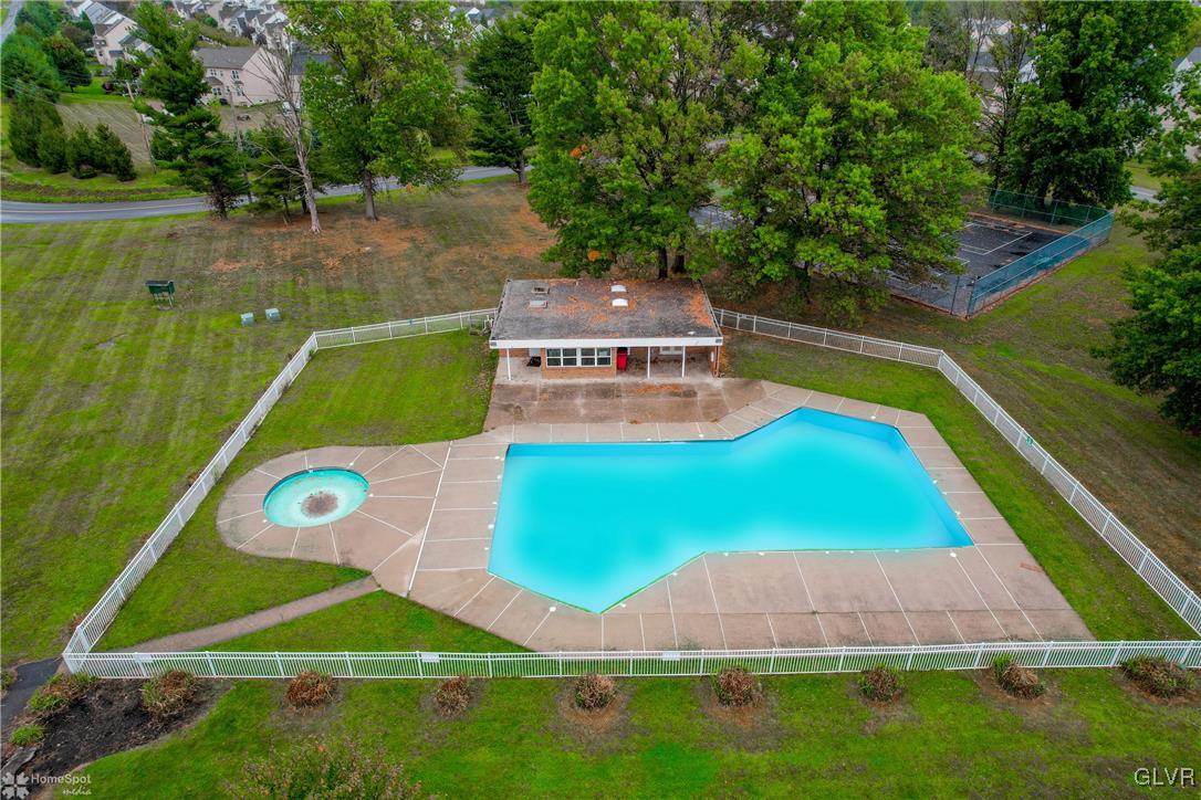 8711 Turkey Ridge Road Breinigsville, PA 18031 - Photo 40 of 40 a view of a tennis ground with a swimming pool