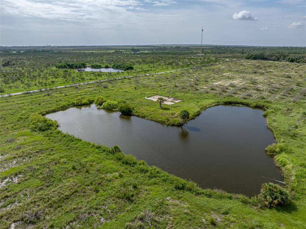 0 Lake Reedy Boulevard Frostproof, FL 33843 - Photo 11 of 11 a view of a lake with a yard