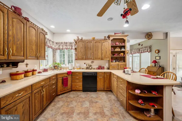 a kitchen with lots of counter top space and appliances