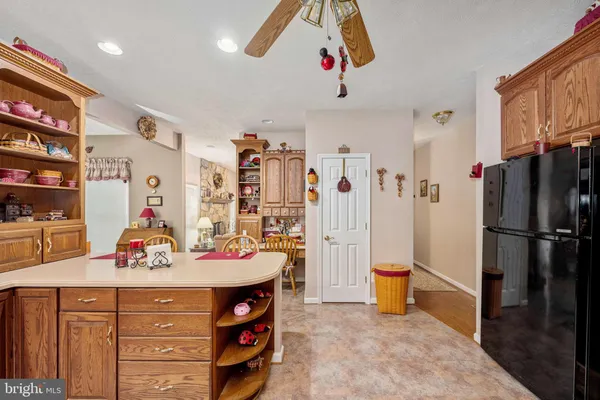 a bathroom with a sink vanity mirror and toilet