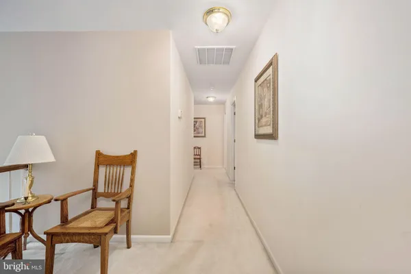 a front view of a house with a garden and yard