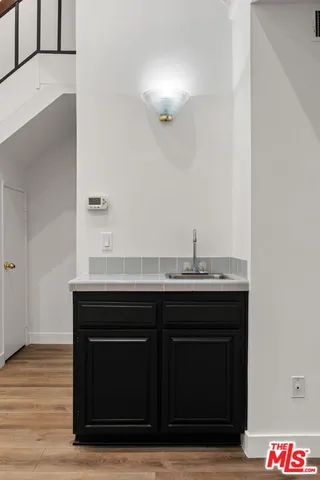 a room with a sink and a mirror