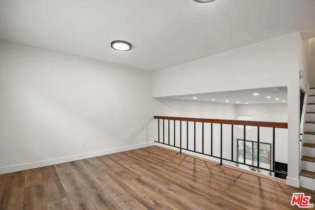 a view of a livingroom with wooden floor