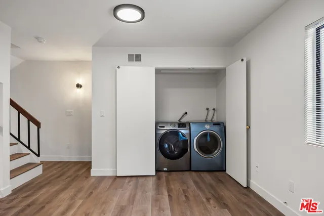 a view of a storage & utility room with wooden floor