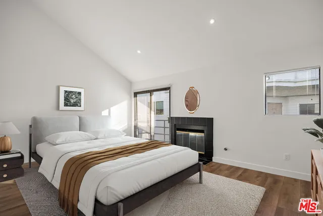 a bedroom with bed and a window