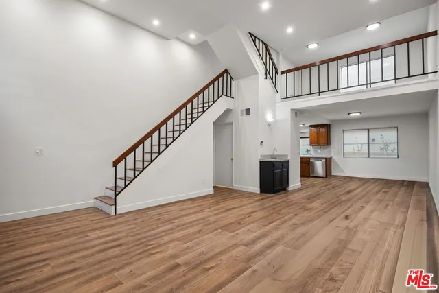 a view of an entryway with wooden floor