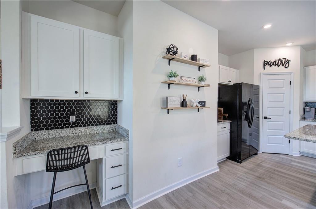 10 Eagle Drive Northwest Cartersville, GA 30121 - Photo 19 of 41 a kitchen with a refrigerator and cabinets