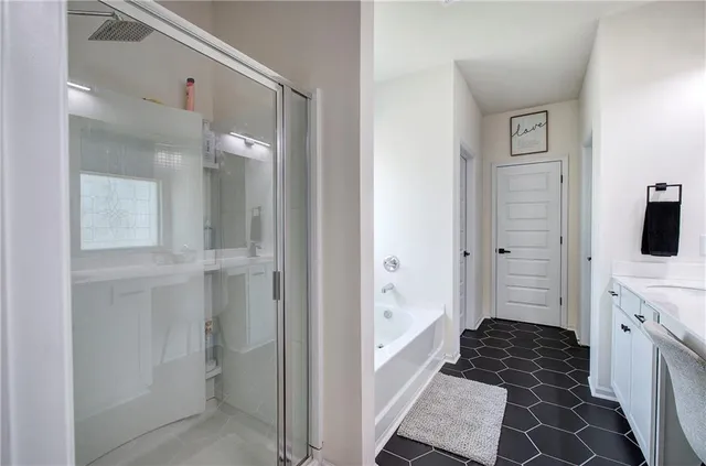 a bathroom with a bathtub and a sink
