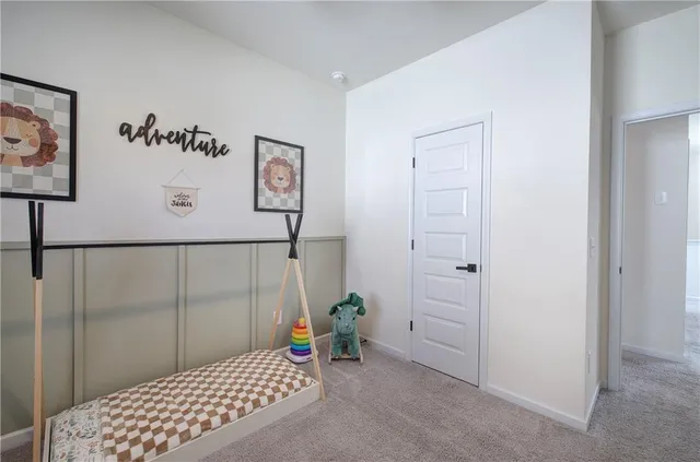 a spacious bedroom with a bed and a window