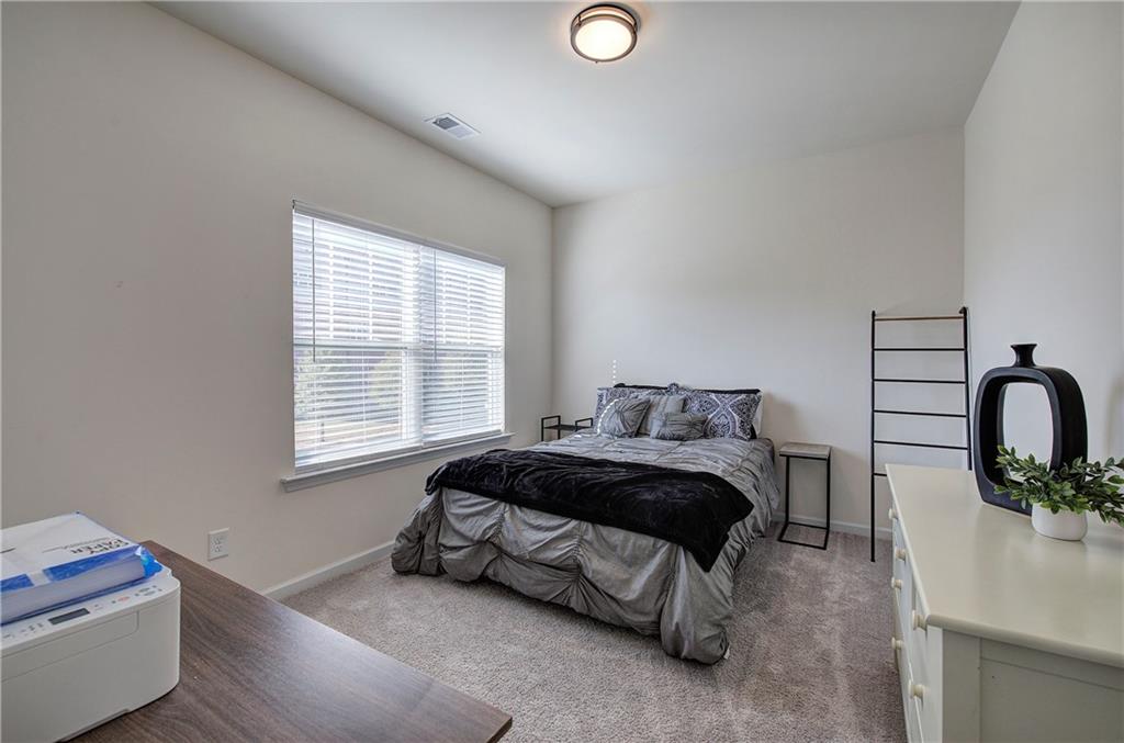 10 Eagle Drive Northwest Cartersville, GA 30121 - Photo 30 of 41 a spacious bedroom with a bed and a window