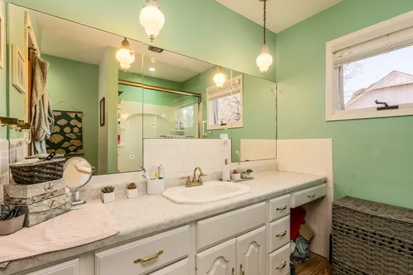 a bathroom with a sink and a mirror