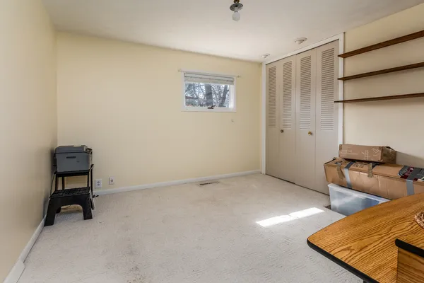 a view of room with furniture and wooden floor