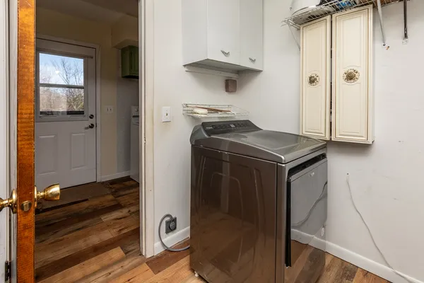 a kitchen with a refrigerator and a stove