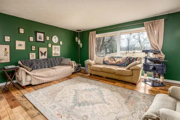 a living room with furniture and a large window