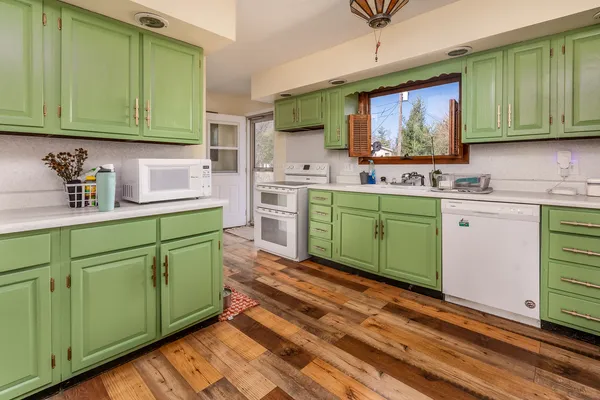 a kitchen with sink and cabinets