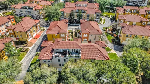 an aerial view of houses with yard