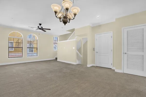 a view of a room with painting on the wall