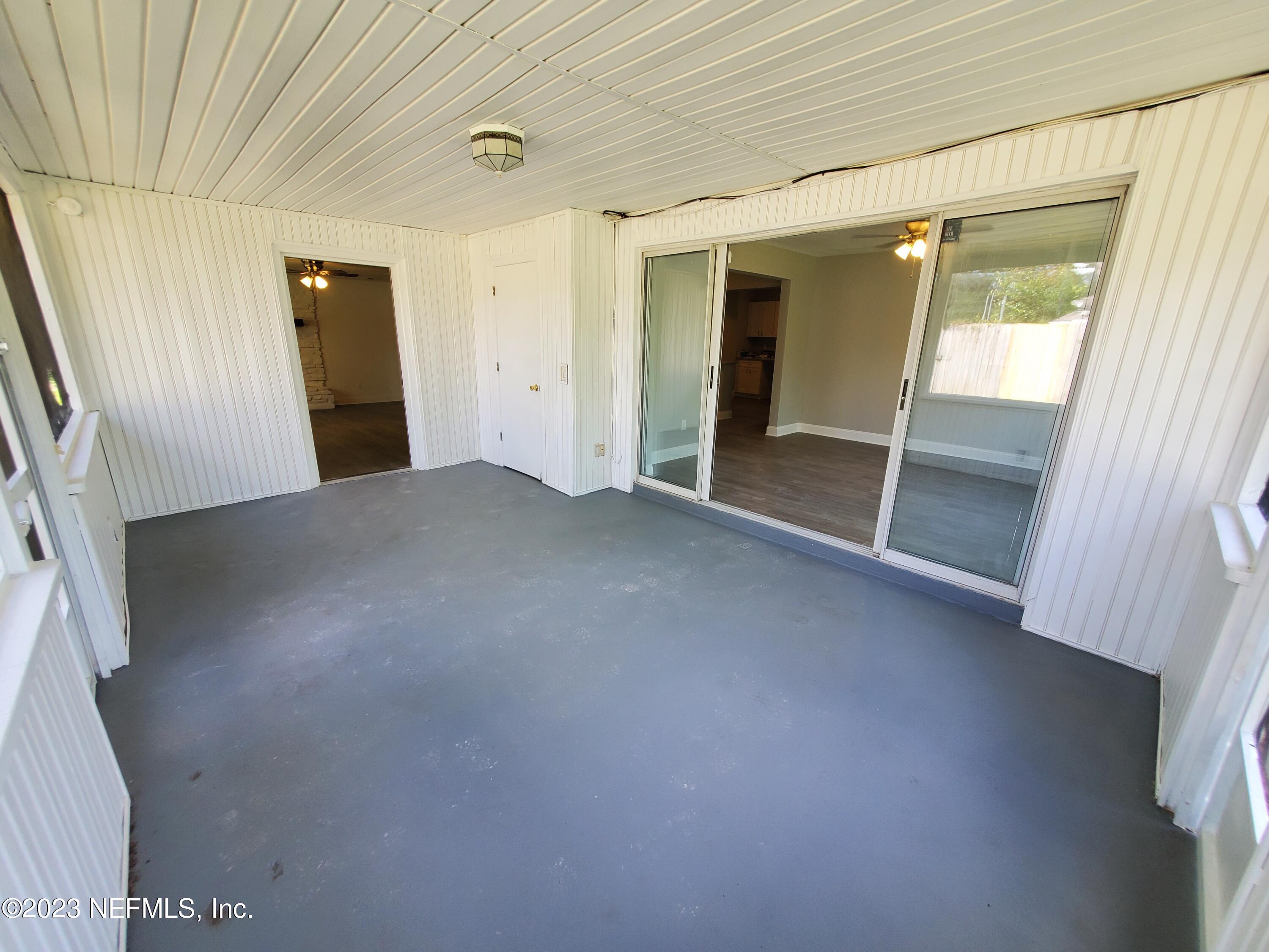 2305 Brest Road Jacksonville, FL 32216 - Photo 13 of 32 a view of a livingroom with an empty space and a window