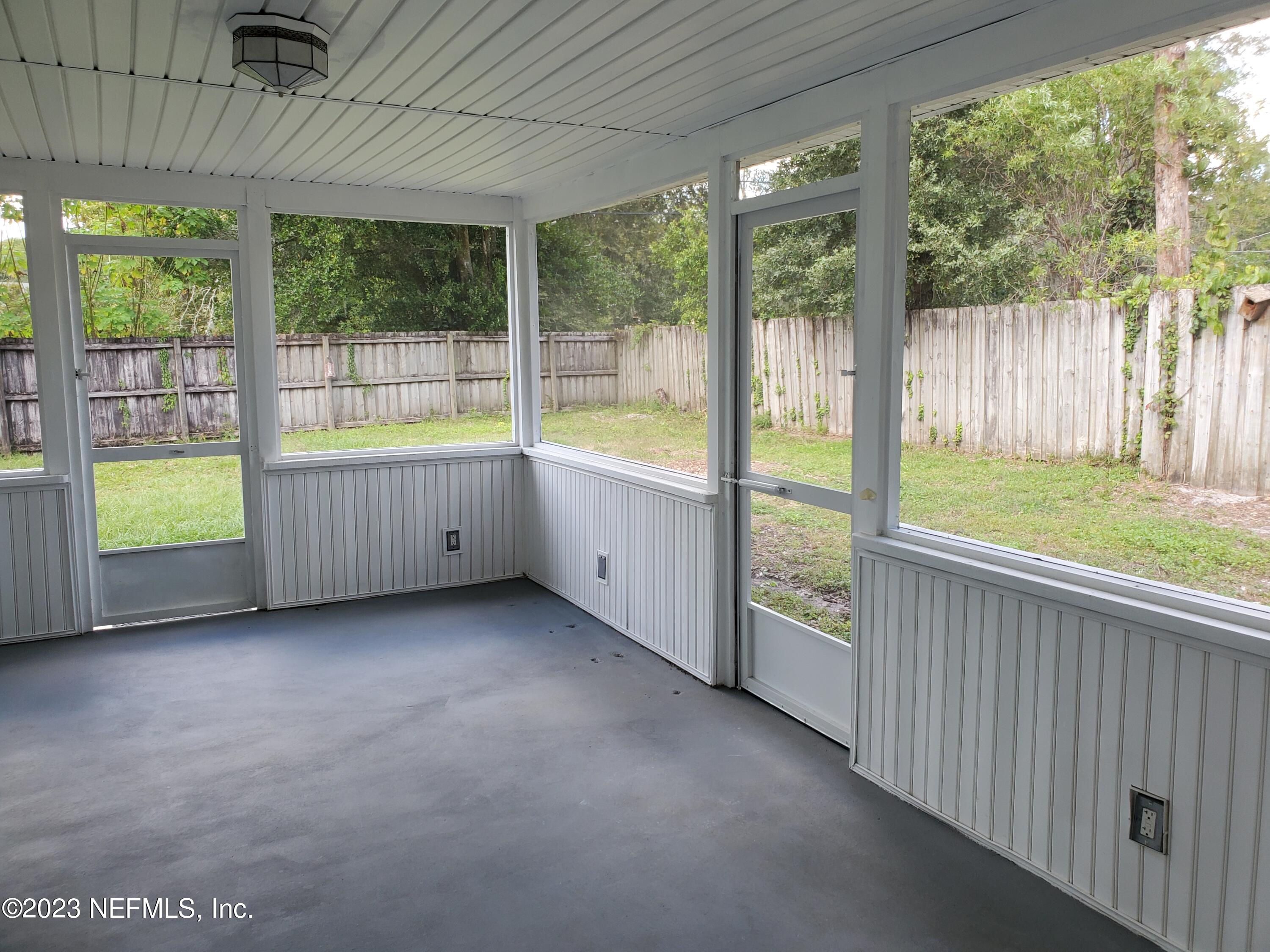 2305 Brest Road Jacksonville, FL 32216 - Photo 14 of 32 a view of an empty room with large windows