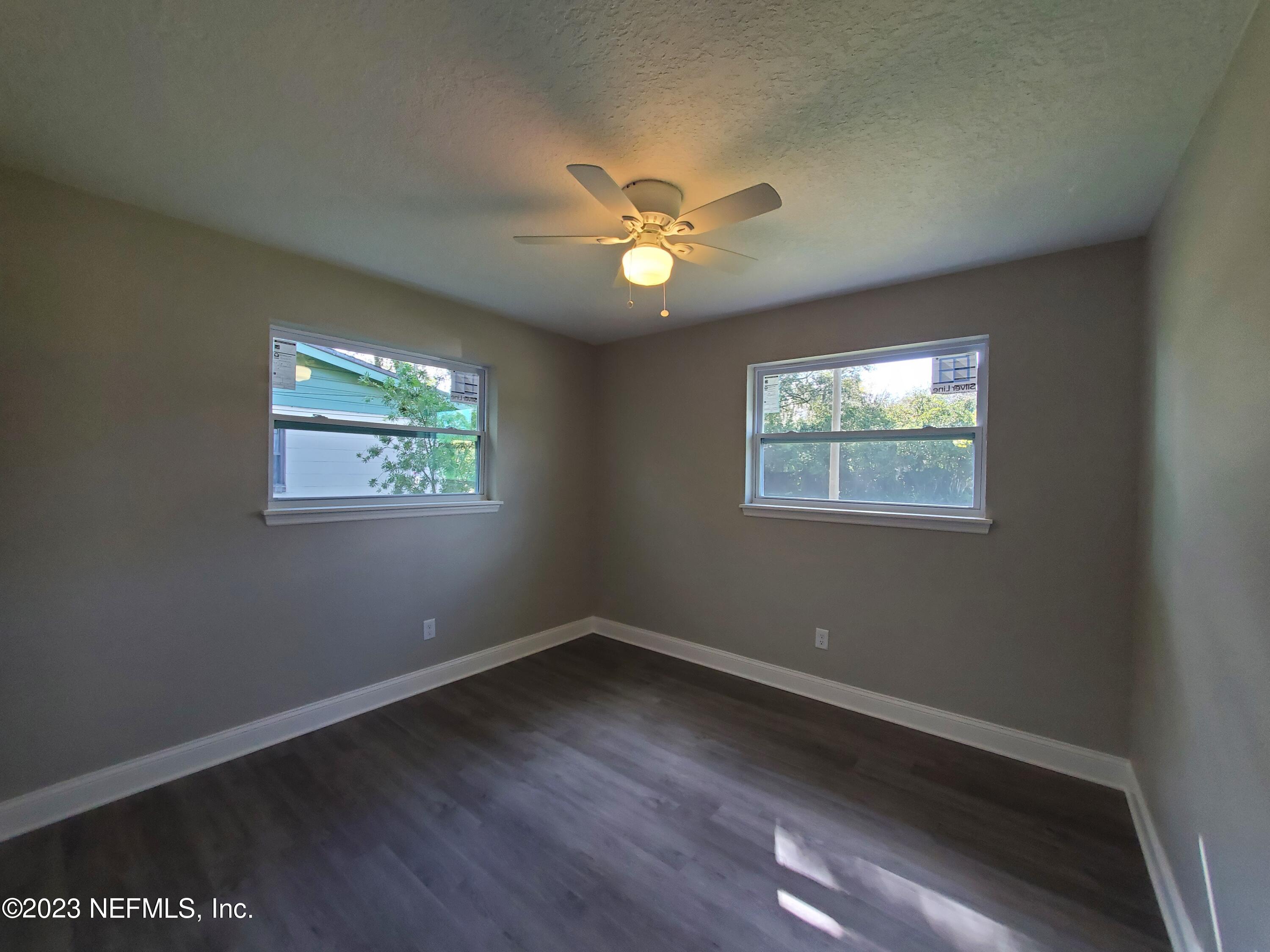 2305 Brest Road Jacksonville, FL 32216 - Photo 21 of 32 a view of wooden floor in an empty room