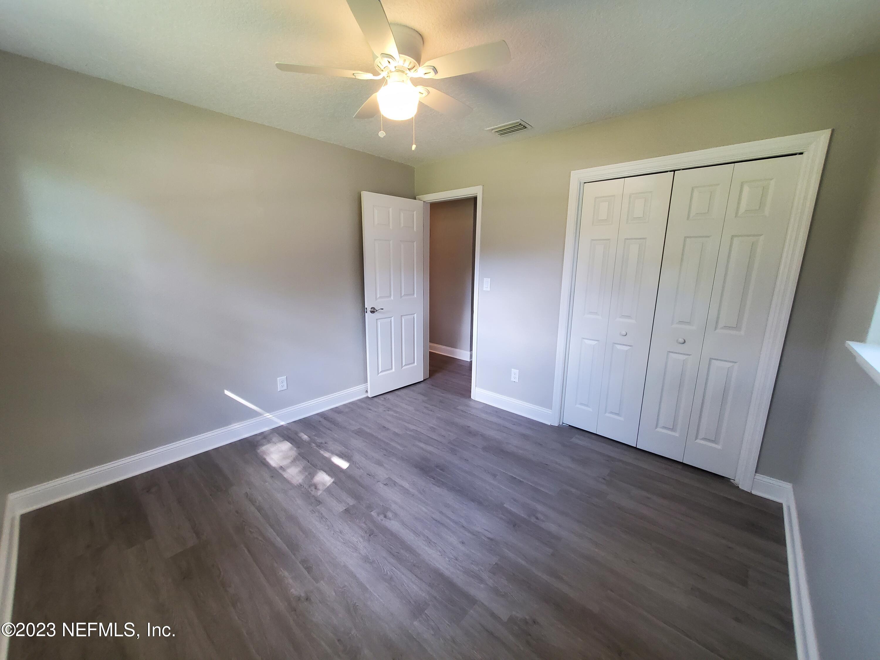 2305 Brest Road Jacksonville, FL 32216 - Photo 22 of 32 a view of an empty room with wooden floor