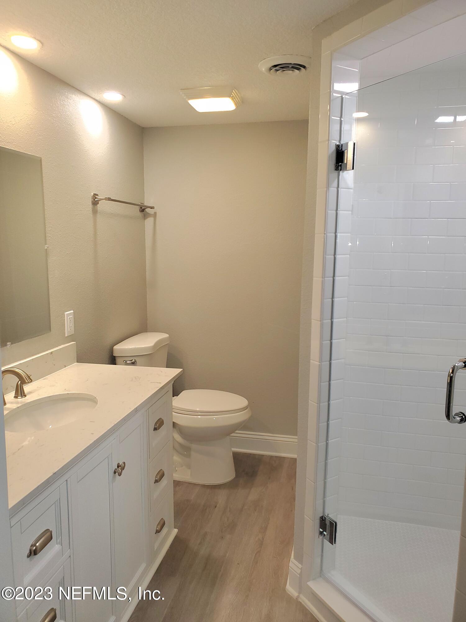 2305 Brest Road Jacksonville, FL 32216 - Photo 25 of 32 a bathroom with a sink a toilet and shower