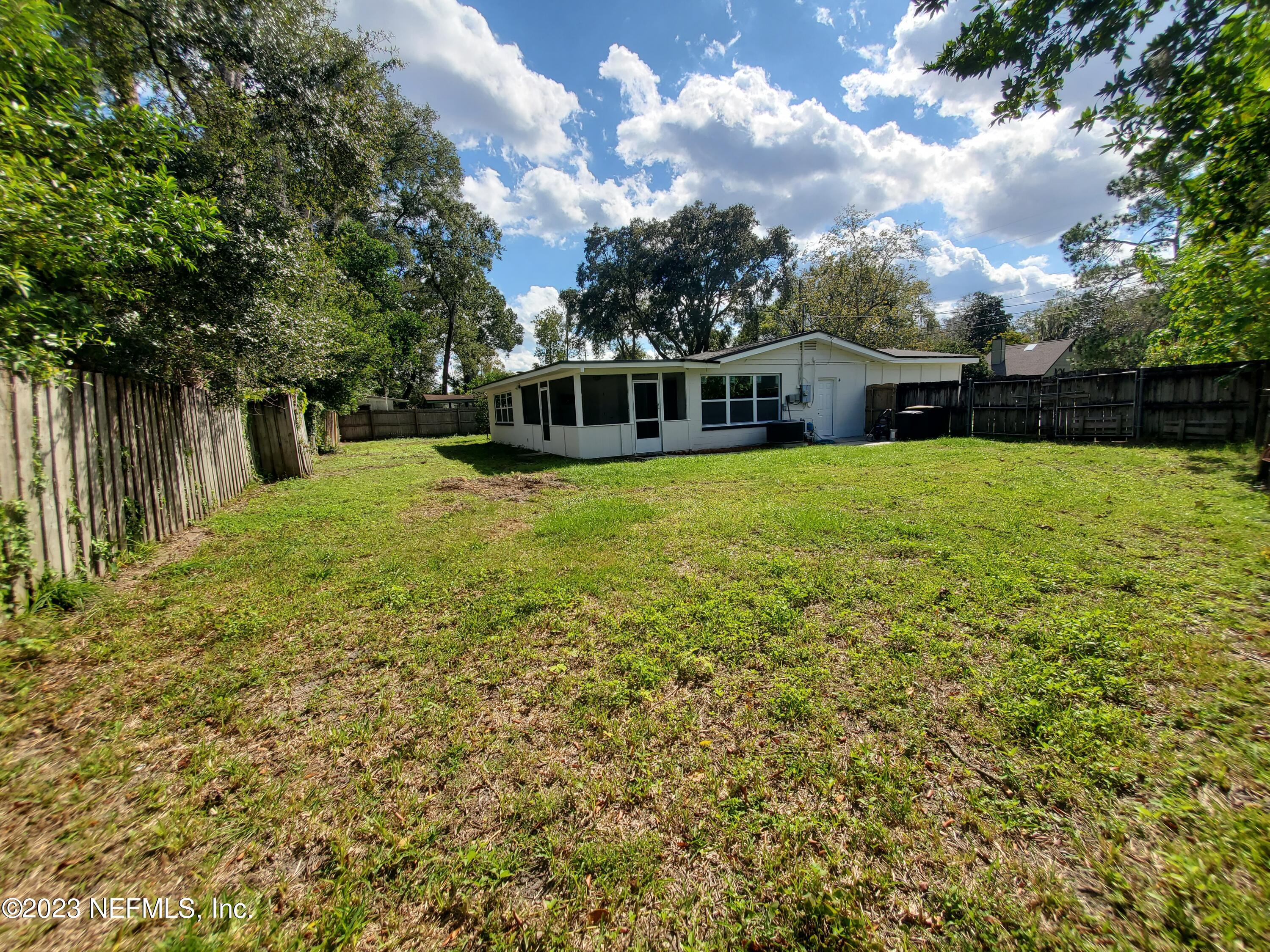 2305 Brest Road Jacksonville, FL 32216 - Photo 26 of 32 a front view of house with yard and trees