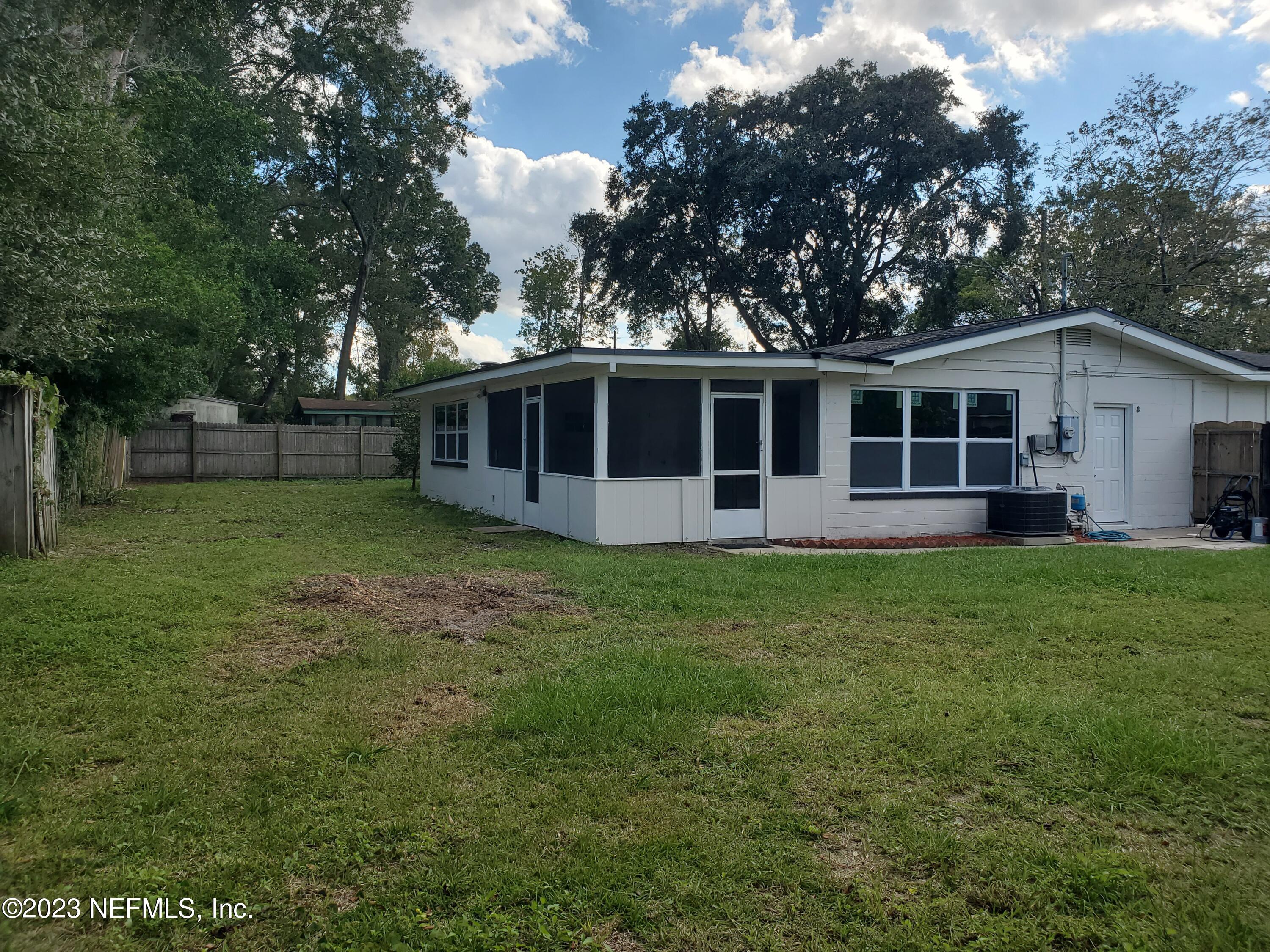 2305 Brest Road Jacksonville, FL 32216 - Photo 27 of 32 a view of a house with a backyard