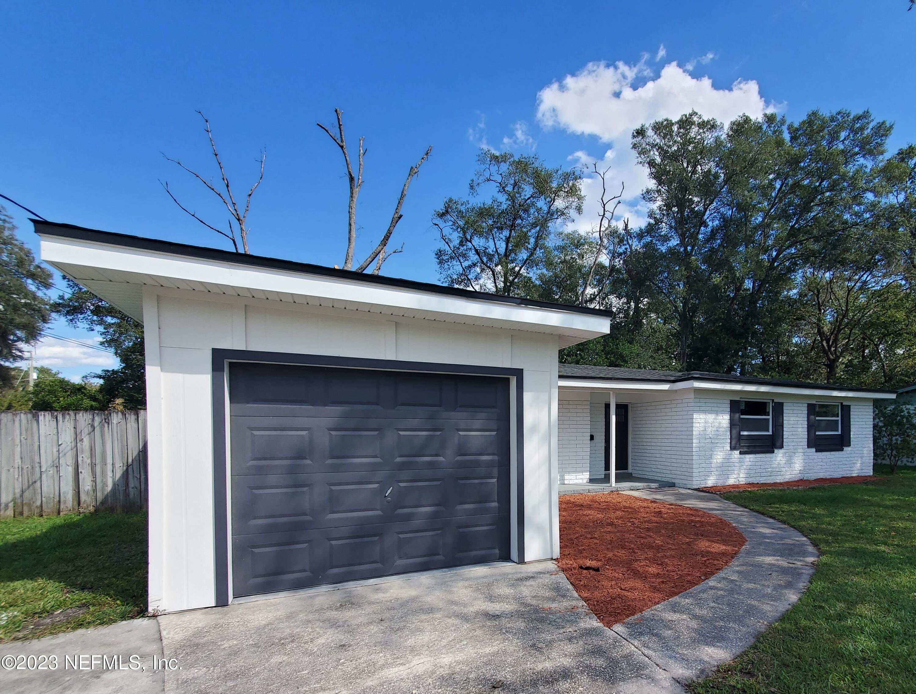 2305 Brest Road Jacksonville, FL 32216 - Photo 31 of 32 front view of a house with a yard