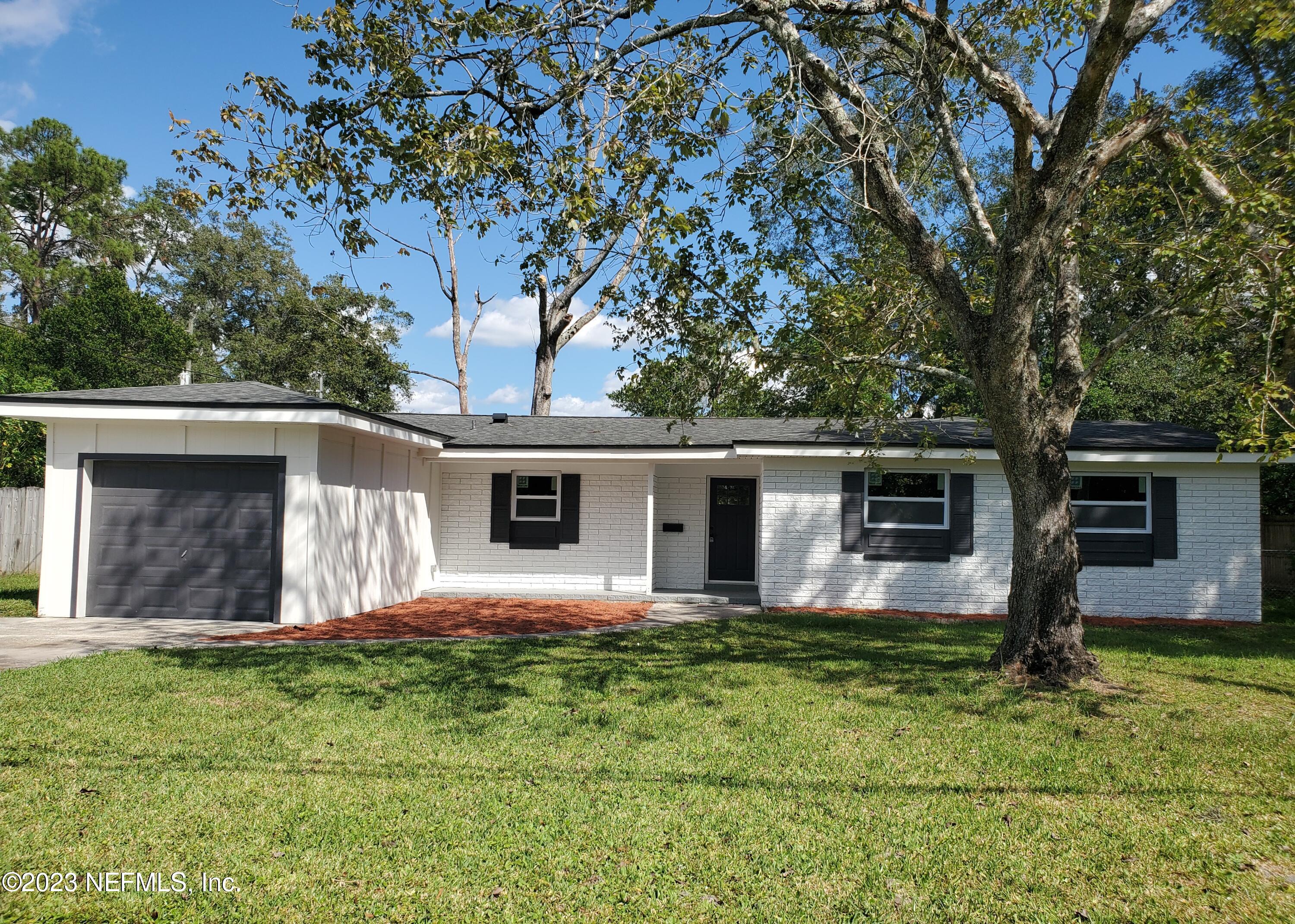 2305 Brest Road Jacksonville, FL 32216 - Photo 32 of 32 a front view of house with yard and trees